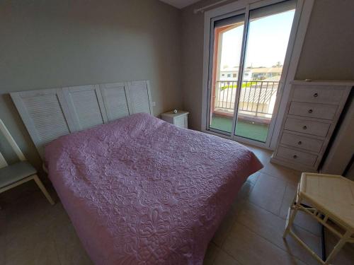 Posteľ alebo postele v izbe v ubytovaní Appartement 2 pièces climatisé en front de mer au Grau d'Agde avec terrasse et accès direct à la plage - FR-1-423-275