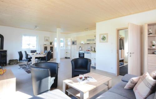 a living room with a couch and a table at Ferienhaus 18 Altefähr in Altefähr
