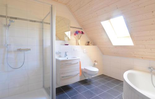 a bathroom with a shower and a toilet and a sink at Ferienhaus 18 Altefhr in Altefähr