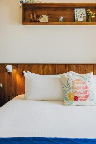 Chuanfanrock Haku Beach Days Innにあるベッド