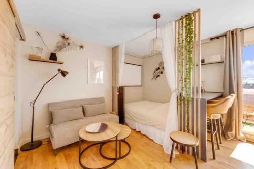 Χώρος καθιστικού στο Appartement Panorama - à seulement 15 minutes des Champs-Élysées