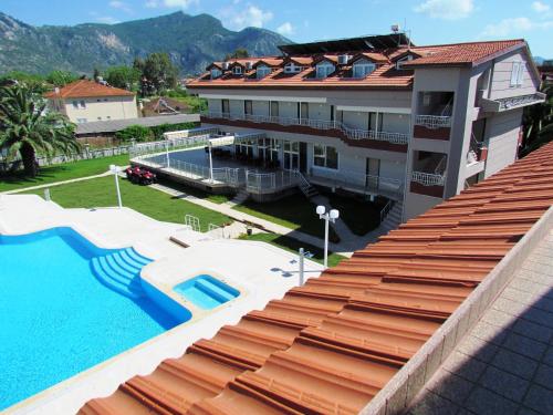 an aerial view of a building with a swimming pool at Dalyan Palmiye Resort Hotel in Dalyan