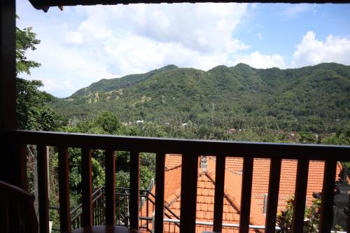 a view of a mountain from a balcony at Bukit Kembang Sari in Bugbug