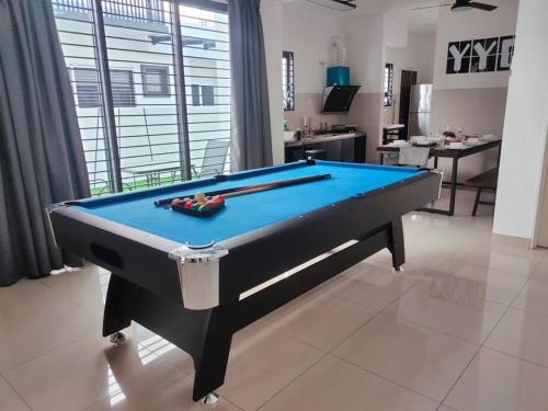 a pool table in the middle of a living room at Shah Alam Setia Alam SCCC 3 Storey Semi D 13 Pax in Shah Alam