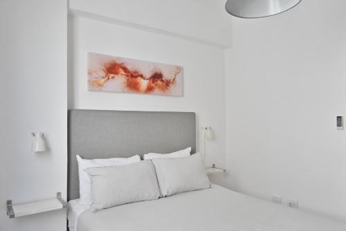 Postel nebo postele na pokoji v ubytování Palmer Suites