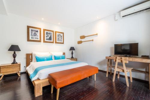 Ένα ή περισσότερα κρεβάτια σε δωμάτιο στο MANA Villas Nusa Dua