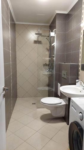 a bathroom with a toilet and a sink at Anthic 7 Apartment 3 in Sozopol