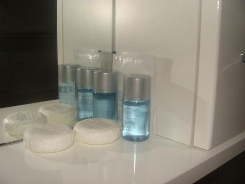 a group of four bottles of soap on a counter at Lugarnica in Zagreb