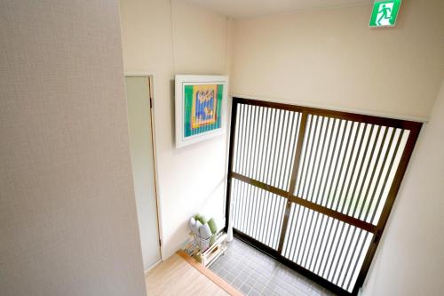 a hallway with a gate in a room at ヒュッテ・ボーデン in Komoro