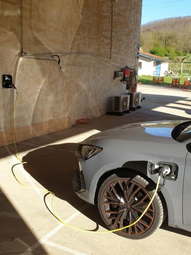 a car is being hooked up to a truck at Chambres et Table d'hôtes "La Pastorale Gourmande" FR - NE - EN - DE - IT in Marcollin