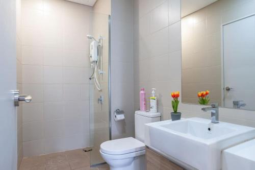 a white bathroom with a sink and a toilet at iCity 2Bedroom RM79 Thempark, Mall, Wi-Fi in Shah Alam