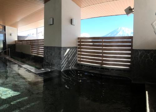 a lobby with a view of a mountain at Niseko Prince Hotel Hirafutei in Niseko