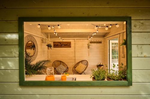 a window of a room with a table and chairs at Little Hayes in Lyndhurst