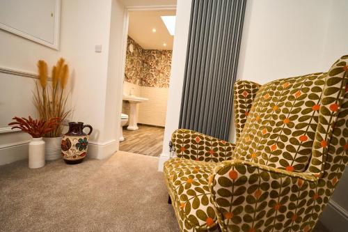 a living room with a couch and a chair at Little Hayes in Lyndhurst