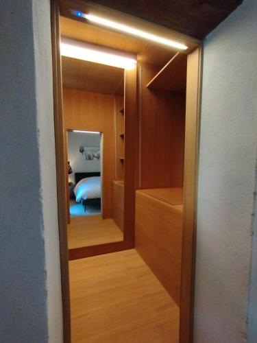 a closet with a door leading into a room at The View - Sunset & Relax - Suite - Appartamenti Vista Lago in Passignano sul Trasimeno