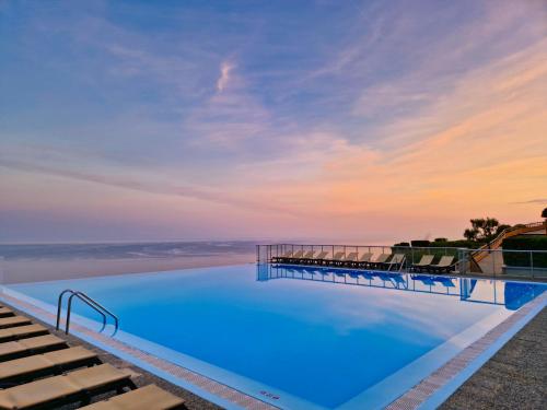 a swimming pool with a view of the ocean at Unique Apartment - Costa Plana in Cap d'Ail