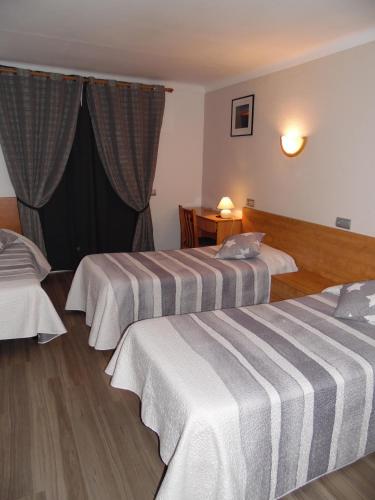 Ένα ή περισσότερα κρεβάτια σε δωμάτιο στο Hostal Santa Clara