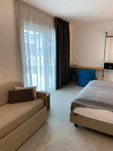 Postel nebo postele na pokoji v ubytování B&B Garda Home