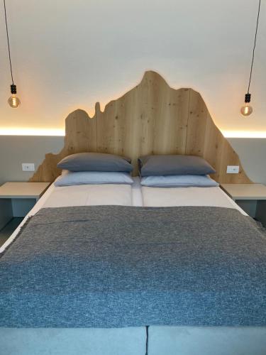 Postel nebo postele na pokoji v ubytování B&B Garda Home