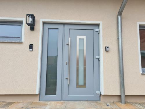 a blue door on the side of a building at Constanza in Plau am See
