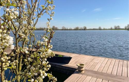 a wooden dock with a view of a lake at Gorgeous Ship In Lith With Lake View in Lith