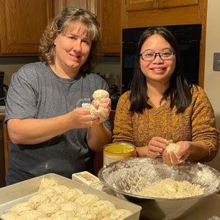 two women standing in a kitchen preparing food at Laurel River Club Bed & Breakfast or LRCBNB in Dryfork