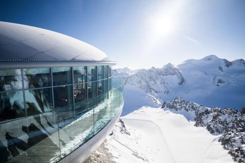 a building on top of a snow covered mountain at Ferienwohnung Rimml in Sankt Leonhard im Pitztal