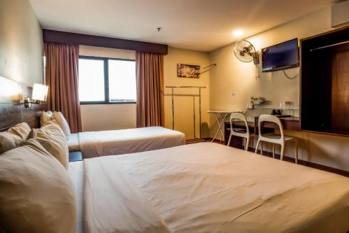 Postel nebo postele na pokoji v ubytování PP Hotel