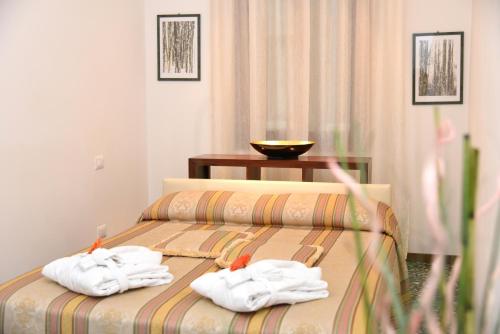 Postel nebo postele na pokoji v ubytování Corte Coppo Superior Apartment
