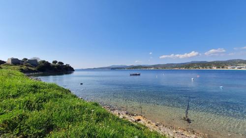 a large body of water with a boat in it at Toroni Pearl in Toroni