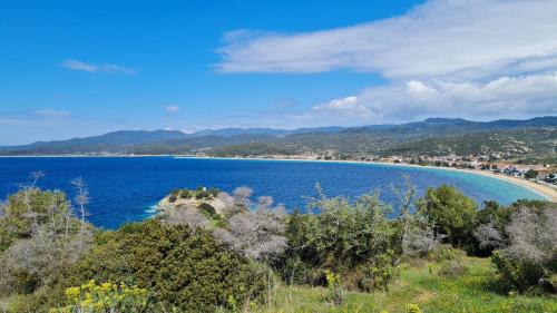 a beach in the middle of a large body of water at Toroni Pearl in Toroni