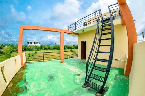a room with a swimming pool with a ladder on a balcony at Aspirations Holiday Villas in Anuradhapura
