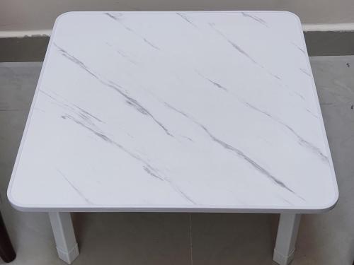 a white bench sitting in a room at بيت الراحة Rest House in Nizwa