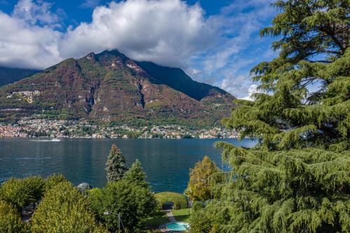 a view of the remarkables mountain from crater lake at Hotel Ristorante Vapore in Faggeto Lario 
