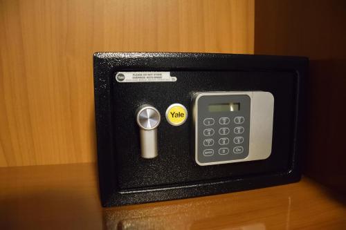 a cell phone in a box on a table at Appartamento Diana Cervia in Cervia