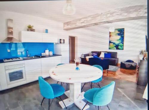 a kitchen and living room with a table and chairs at DOROTEA3 in Makarska