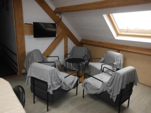 TV a/nebo společenská místnost v ubytování Logies 't Eenvoud (rooms)