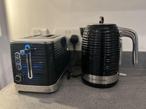 a toaster sitting on top of a counter at East London penthouse views 2bd in Barking