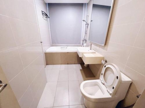 a small bathroom with a toilet and a sink at PROMO Connected Train 2 Bedroom ABOVE MALL 289 in Kuala Lumpur
