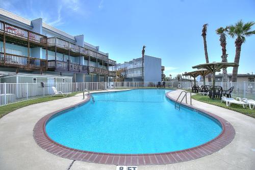 a large swimming pool in front of a building at Bay Tree B4 in Port Aransas