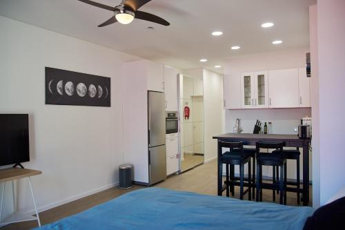 a kitchen with a table and chairs in a room at Studio Apartment in the Heart of Riga Old Town in Rīga
