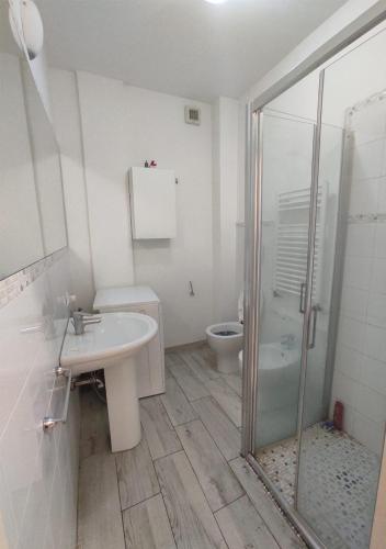 a bathroom with a toilet and a sink and a shower at Appartamento a due passi dal mare. Civitanova M. in Civitanova Marche