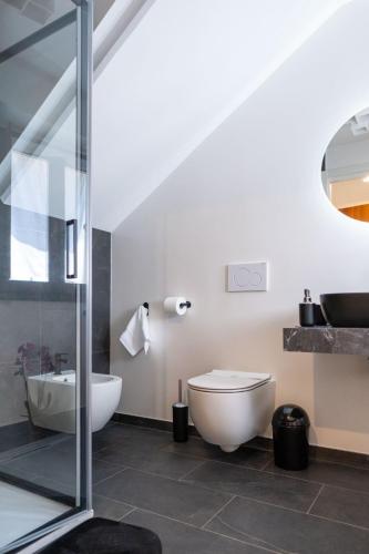 a bathroom with a toilet and a sink at TibetiAmo in Castelsaraceno