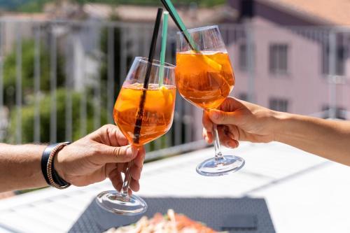 two people holding up two wine glasses at TibetiAmo in Castelsaraceno