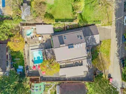 an aerial view of a house with a yard at The Lions Self Contained Suite, Shared Pool, Hot Tub, Views in North Vancouver