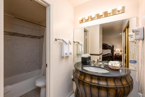 a bathroom with a sink in a large wooden barrel at Casa Mariquita Hotel by Omeo in Avalon