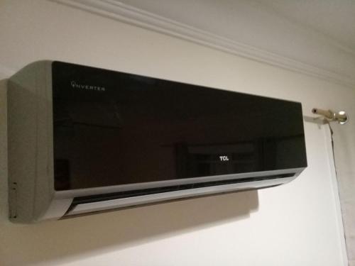 a flat screen tv hanging on a wall at Private Guest House 2 bedrooms & 2 baths near Grace Bay Beach & Long Bay Beach. in Providenciales