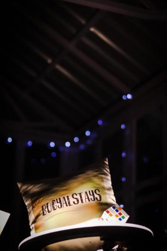 a bed in a room with a pillow with the words boston stars at Forest Cabin Bugyal Stays in Pauri