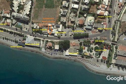 a map of a city next to the water at Sunwaves Beach studio I in Ialyssos