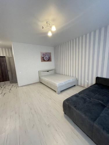 a bedroom with two beds in a room at Sea 406 in Odesa